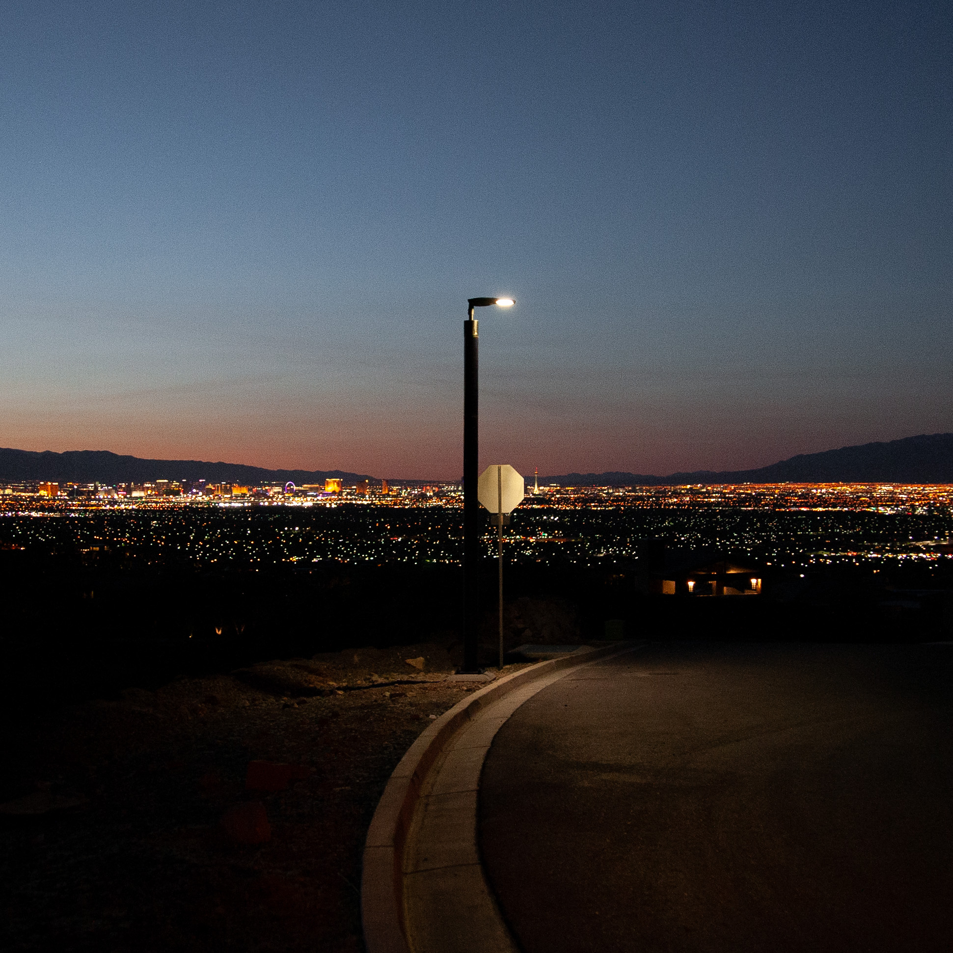 Soluxio solar pathway lighting with Las Vegas skyline in the background at dusk